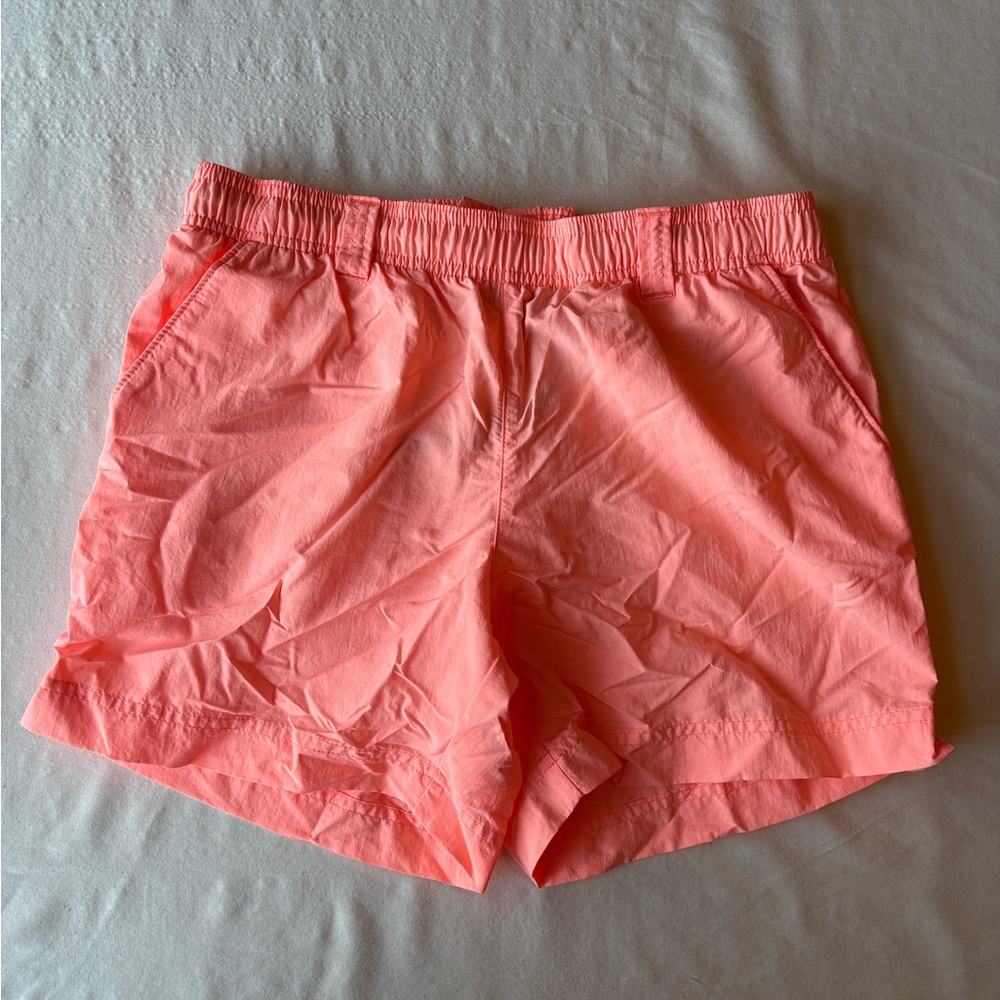 Columbia PFG Backcast shorts in a Coral Pink